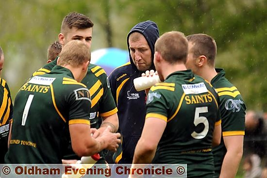 OLDHAM St Anne’s coach Mick Fogerty gathers his troops for a half-time team talk. 