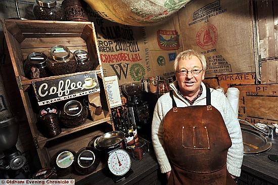 FULL of beans . . . Brian in his new Uppermill shop 