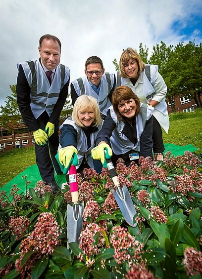 GREEN deal . . . (back, from left) Mark Parker, Forrest operations director, Lee McCarren, Forrest chief executive, and Maria O’Brien, First Choice Homes Oldham B Green project manager. Front: Cath Green, FCHO chief executive, and Michele Carr, assistant executive director, housing and planning, Oldham Council 
