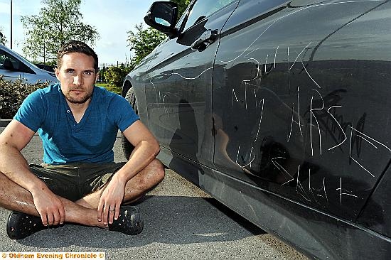 RUDE discovery. . . Chris Buckley with his damaged BMW