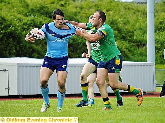 Oldham’s Josh Crowley gets to grips with a Gloucester attacker. Pictures: LEWIS MITCHELL. 
