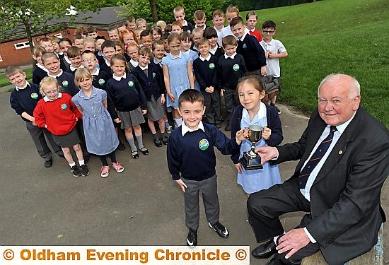 CONGRATULATIONS...John Cleary (who helped organise the first festival) presents Harrison Curtis and Emily Higham from Hodge Clough Primary with the John Cleary Trophy. They performed Roald Dahl’s “Jack and the Beanstalk” and “Witches Spell” from Shakespeare’s Macbeth.