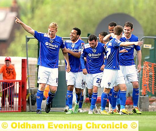 HEAD MASTER: Adam Lockwood celebrates his goal with his teammates. 