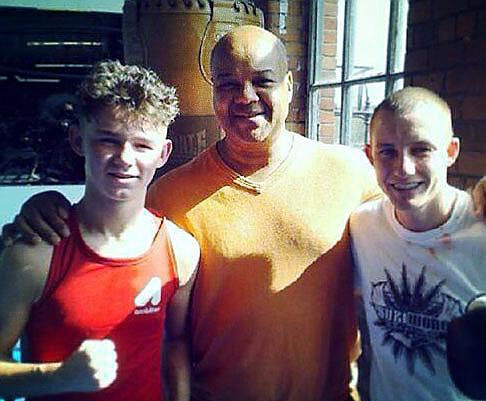 Eric Noi flanked by Will Cawley (left) and IBF world champion Paul Butler.
