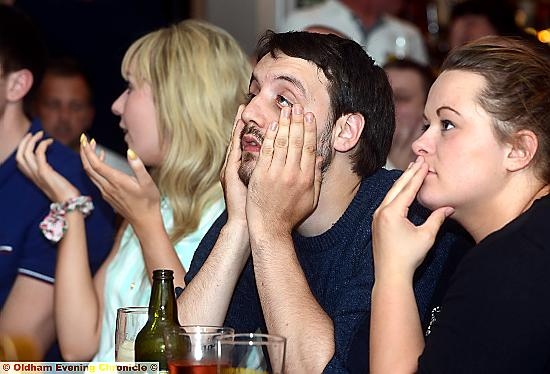 TENSE STUFF: Customers at the Colliers watch the England v Uruguay match