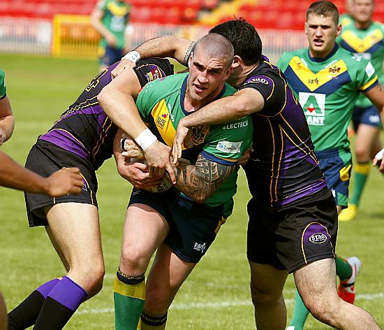 OLDHAM’S Dave Cookson is held as he tries to break through. PICTURE: John Millard. 
