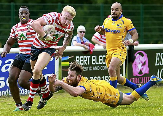 George Tyson powers through the last tackle to score a try for Oldham - but at the oother end of the pitch Oldham gave Hemel too much room