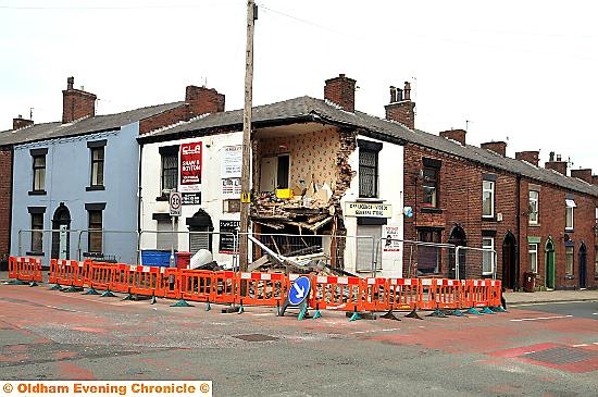 Destroyed . . . the wrecked shop on Fraser Street, Shaw.