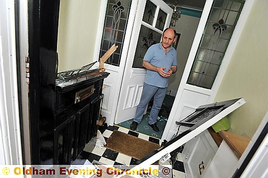 Gary Schofield at his smashed in front door in Garden Suburb.
Gary Schofield at his smashed in front door in Garden Suburb.