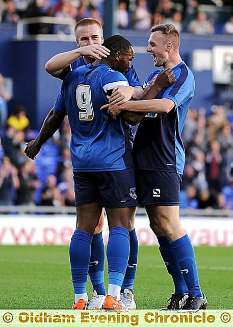 William Gross joins teammates in his wining-goal celebration