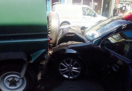 The damaged police car.