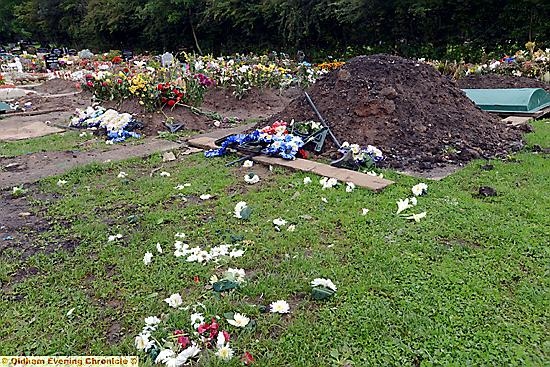 Damage to grave in the Muslim section of Chadderton Cemetery.