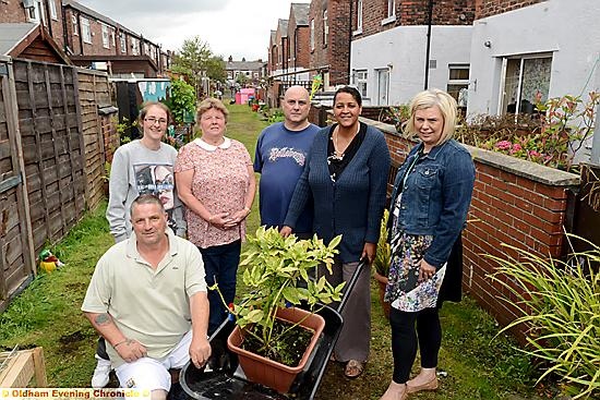 Neighbours from Mather Street and Dalton Street in Failsworth have transformed their shared alley into a local beauty spot, Malton Garden. From left, Bernard Roscoe (kneeling), Stacey Byrne, Sonia Chapman, Carl Crawford, Cheryl Brock, Penny Kenworthy, Failsworth and Hollinwood district team