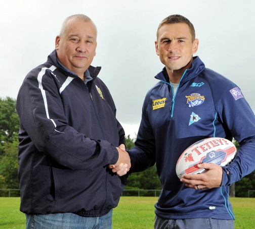 PUT IT THERE: Kevin Sinfield (right) at Waterhead Rugby Club with vice-chairman Simon Holland.