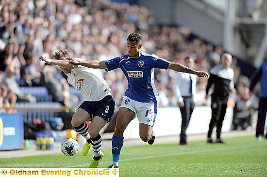 UP FOR IT . . . Athletic striker Jonson Clarke-Harris battles for possession. 