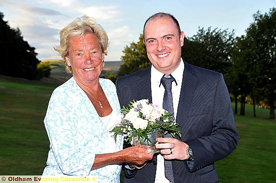 Eileen Milne presents Lee Rowbotham with Eric Milne trophy...Partner Fiona Dooley was at her own 50th birthday celebrations.
