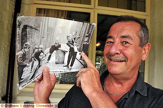 SHANE Clegg was bowled over when he caught a glimpse of some familiar faces playing cricket in the old photograph at the Whitehouse Inn.


He spotted the black and white snap on display and recognised his brothers — as youngsters — straight away.

As a 15-year-old fielder, Alan Clegg (far left) and the late Barry Clegg (12) (second left) are pictured as their pal cleanly strikes the ball with a homemade bat.