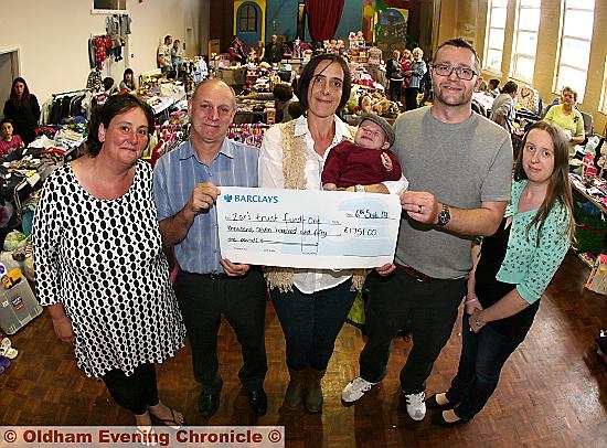 CARING in Lisa’s memory: from left, fundraiser Sarah Limb, Lisa’s father Robert, Lisa’s suster Ally Ziemniak with Zac, Aaron Ziemniak and Karen Jones of Kit4Kids