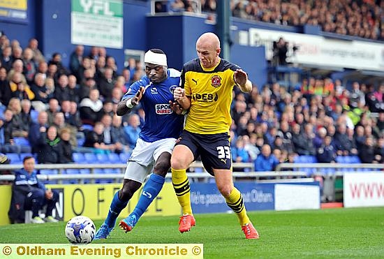 The injured George Elokobi shows the kind of determination that has made him a fans-favourite.