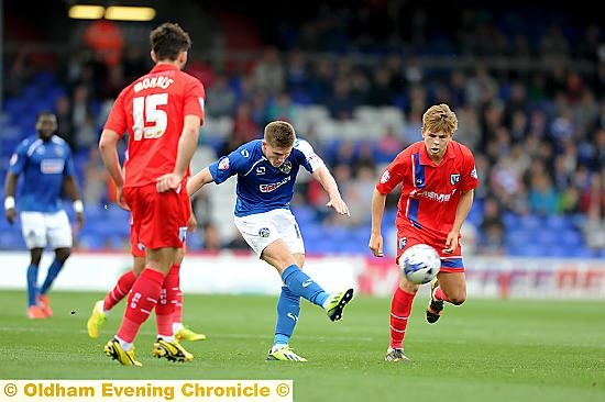 DANNY Philliskirk unleashes a shot at the Gillingham goal.