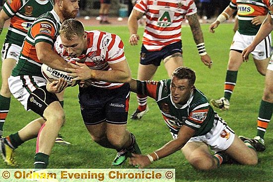 NO STOPPING HIM: Danny Langtree powers through to score a try for Oldham.