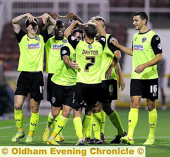 Athletic players celebrate James Dayton’s superb goal.