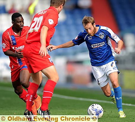 WINGING IT: James Dayton, who scored a memorable goal at Swindon, sets off on a run against Gillingham.