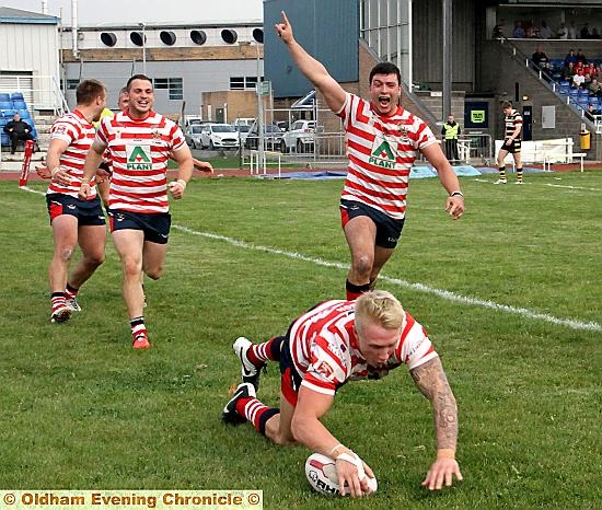 OVER WE GO: George Tyson clinches a brilliant Oldham victory against York City Knights with his side’s fifth and final try. PICTURE: DAVE MURGATROYD