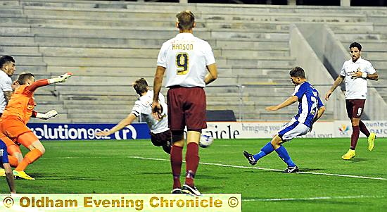 IT’S THERE: Jordan Bove pounces to score Athletic’s late winner.