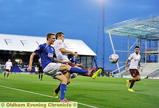 TERRIFIC FORM . . . Carl Winchester in the thick of the action against Bradford City on Tuesday.