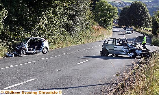 the damaged vehicles after the crash in Delph