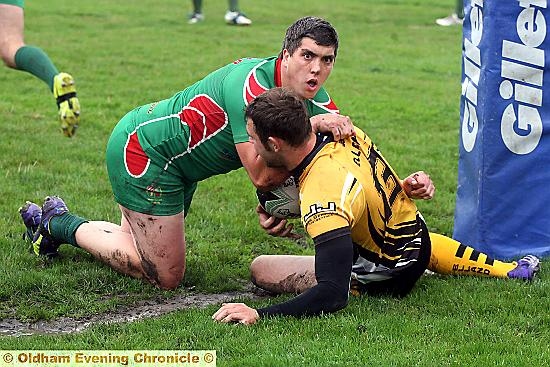 Waterhead’s Darren Nixon pounces on an Elland opponent.