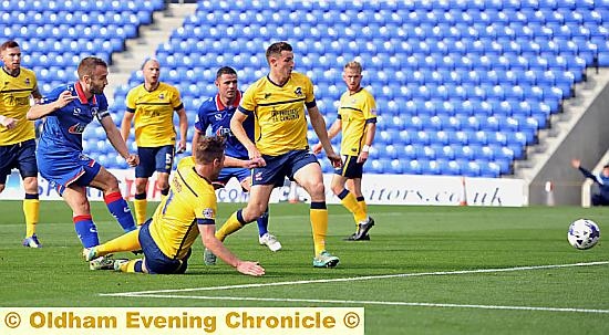 Liam Kelly scores Latics’ equaliser.