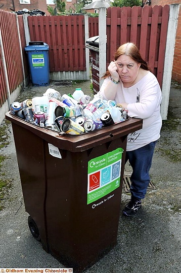 Pamela Kay - with overflowing recycling bin Pamela Kay - with overflowing recycling bin