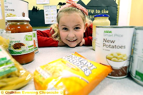 FEEDING those less fortunate . . . Kendra Marland paid for a hamper of food for Oldham Foodbank