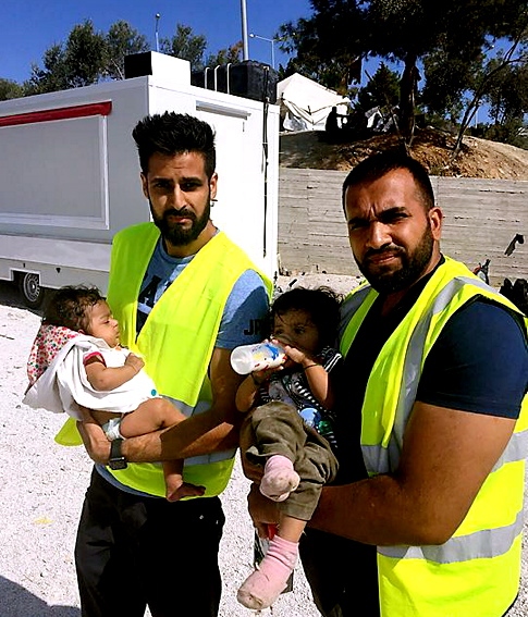 EMOTIONAL journey . . . Sajjad (right) with a volunteer from High Wycombe and Syrian orphans