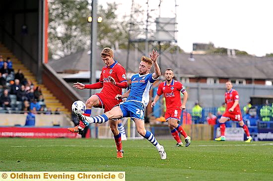 GET STUCK IN . . . this midfield duel epitomised Jay Fulton’s contribution.