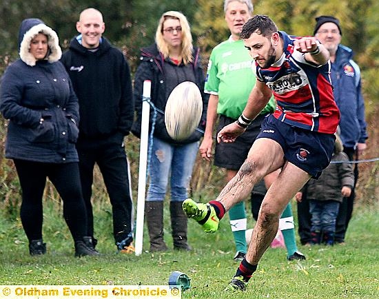 WATCHING OVER YOU: Jamie Mayall kicks for goal. WATCHING OVER YOU: Jamie Mayall kicks for goal.