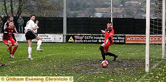 Mitch Bryant, scores the second goal for Mossley.
Mitch Bryant, scores the second goal for Mossley.