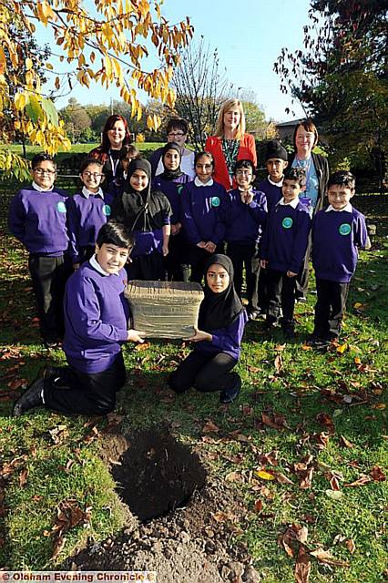Freehold Community School has become Freehold Community Primary Academy. To celebrate the change the Academy council buried a time capsule and all the pupils held a balloon launch. Pic shows councillors with head boy Abu-Darda Khan (left) and head girl Maheeda Bibi holding the time capsule. Back row left to right are Erica Lees (Asst. Principal), Debra Warren (Vice-Principal), Helen Rowlands (CEO Focus Trust), Angela Leach (Principal).