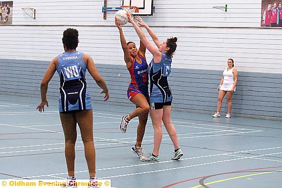 IT’S MINE . . . Oldham’s Laura Malcolm is put under pressure by her Academy rival at Hathershaw College. 
