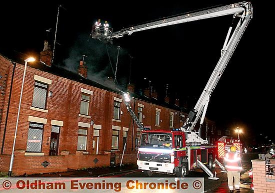 Firemen from Greater Manchester Fire Brigade attend a house fire on, Greenhill road, Chadderton. Firemen from Greater Manchester Fire Brigade attend a house fire on, Greenhill road, Chadderton.