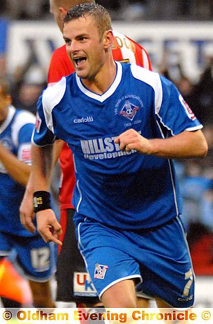 Richie Wellens wheels away after scoring his 1st, and Latics 3rd, goal of the afternoon.