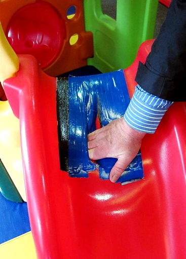A badly repaired tear in one of the play items A badly repaired tear in one of the play items