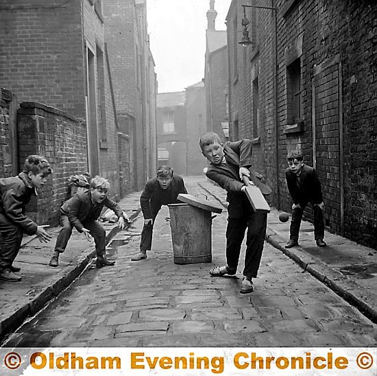 Youngsters play cricket in Rothwell St. Mumps Oldham. Youngsters play cricket in Rothwell St. Mumps Oldham.