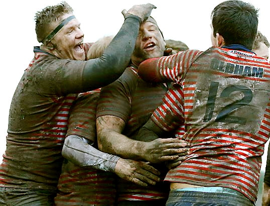 WELL DONE, MATE: Rhys Jones is congratulated by his Oldham team-mates after levelling the scores with the side’s first try.