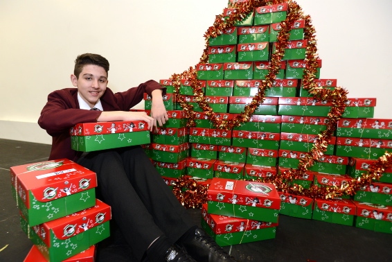Christmas message: Kevin Kociu with some of the shoeboxes collected at Hathershaw College Christmas message: Kevin Kociu with some of the shoeboxes collected at Hathershaw College