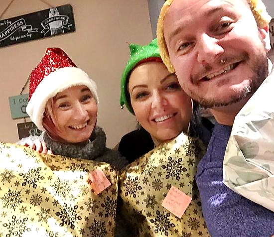 SANTA cheer is on its way . . . Neil Greenwood wrapping presents with helpers SANTA cheer is on its way . . . Neil Greenwood wrapping presents with helpers