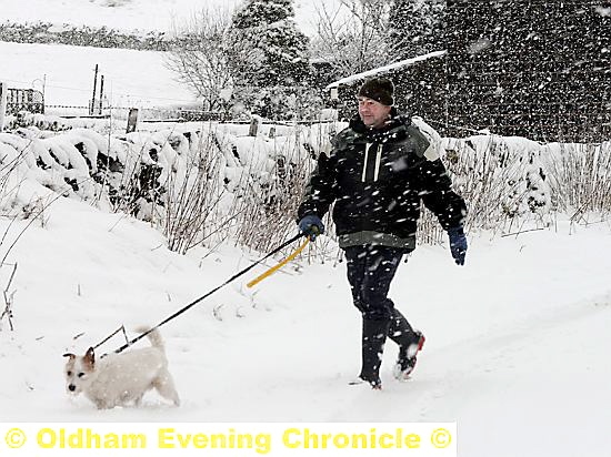 Robert Wells with his dog Alfie in Higher Turf Lane, Scouthead. Photo: Anthony Miller.