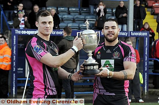 FLASHBACK . . . to February, 2013 at Spotland. Oldham’s Lewis Palfrey (left) and Sammy Gee show off the Law Cup after their team’s victory over Rochdale. FLASHBACK . . . to February, 2013 at Spotland. Oldham’s Lewis Palfrey (left) and Sammy Gee show off the Law Cup after their team’s victory over Rochdale.